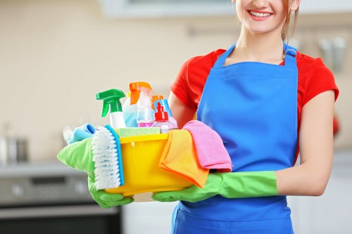 Carpet cleaning technician preparing equipment in a safe working environment