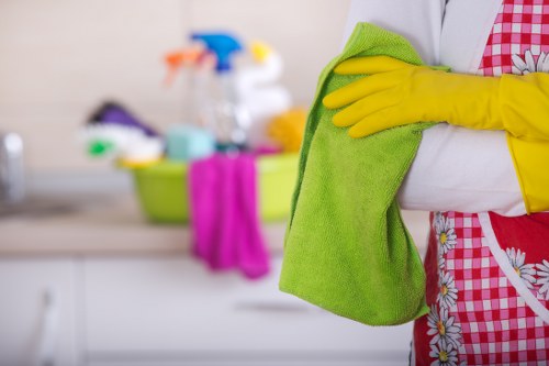 Technician treating stains during upholstery cleaning in Finchley